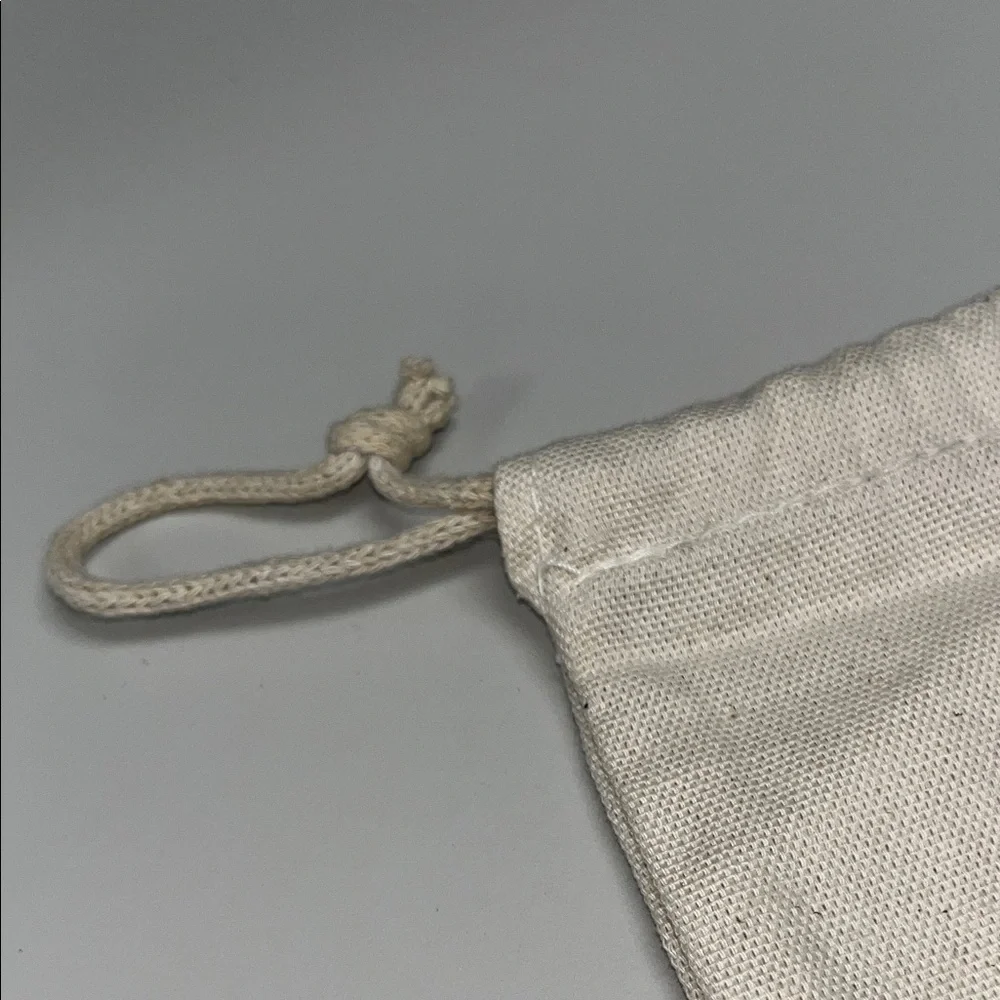 The House of Noa Cream Drawstring Dust Bag with darling print